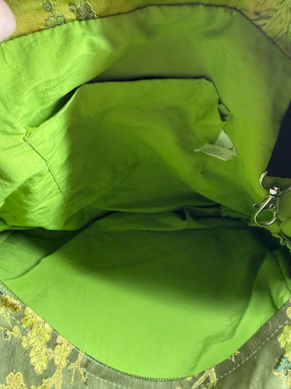 Petunia Pickle Bottom diaper bag in a green, silky, bamboo-themed fabric